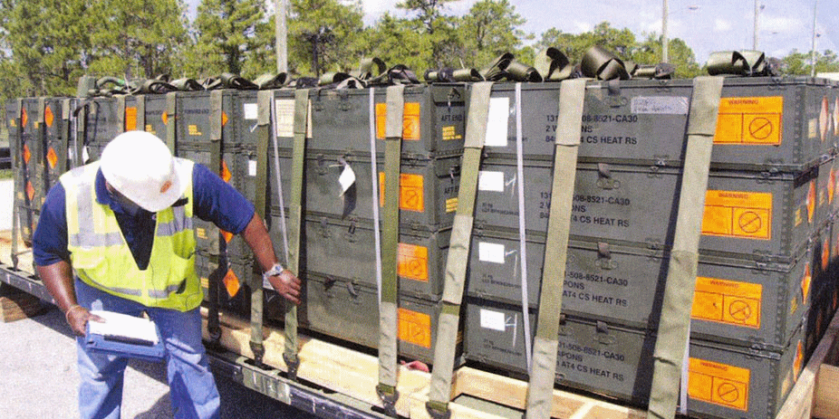 Worker inspecting Davis aircraft cargo securing systems