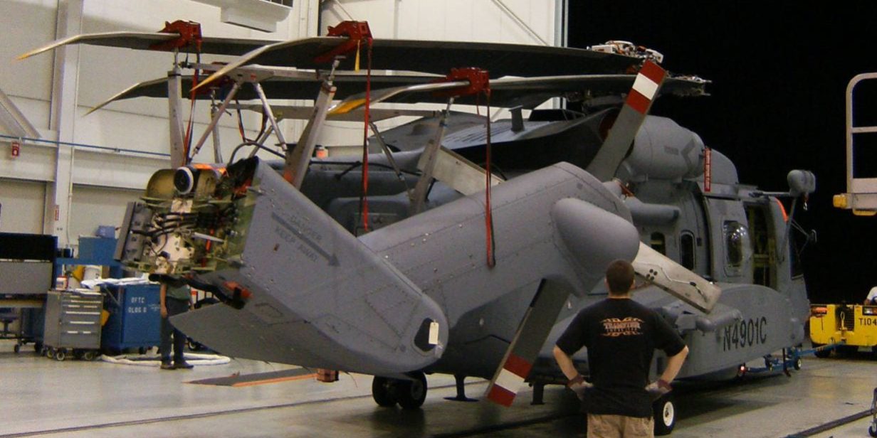 Sikorsky CH-148 Cyclone using Davis Aircraft blade fold kit being stored towed out of a hangar