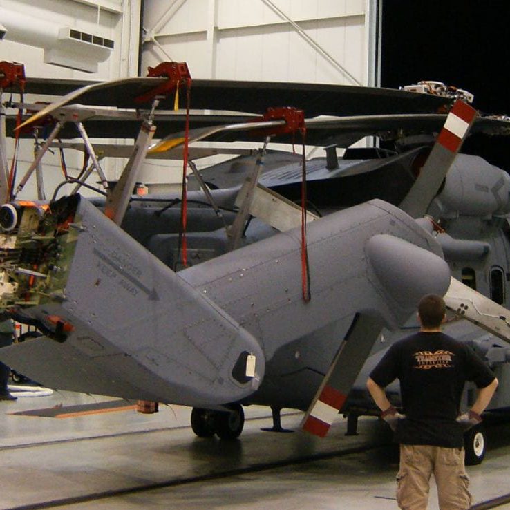 Sikorsky CH-148 Cyclone using Davis Aircraft blade fold kit being stored towed out of a hangar