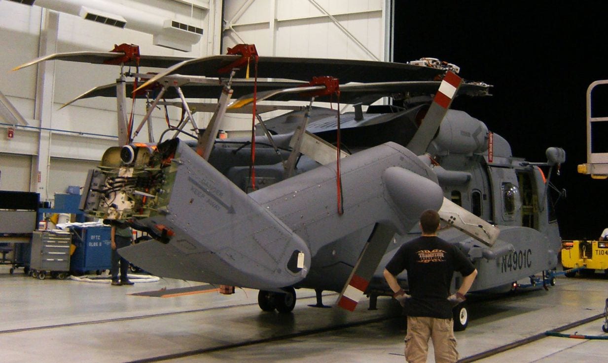 Sikorsky CH-148 Cyclone using Davis Aircraft blade fold kit being stored towed out of a hangar