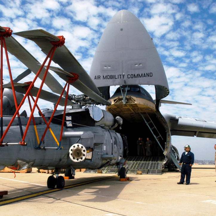 Sikorsky SH-60 helicopter entering into an C-17 Globemaster aircraft equipped with Davis Aircraft's blade fold assembly